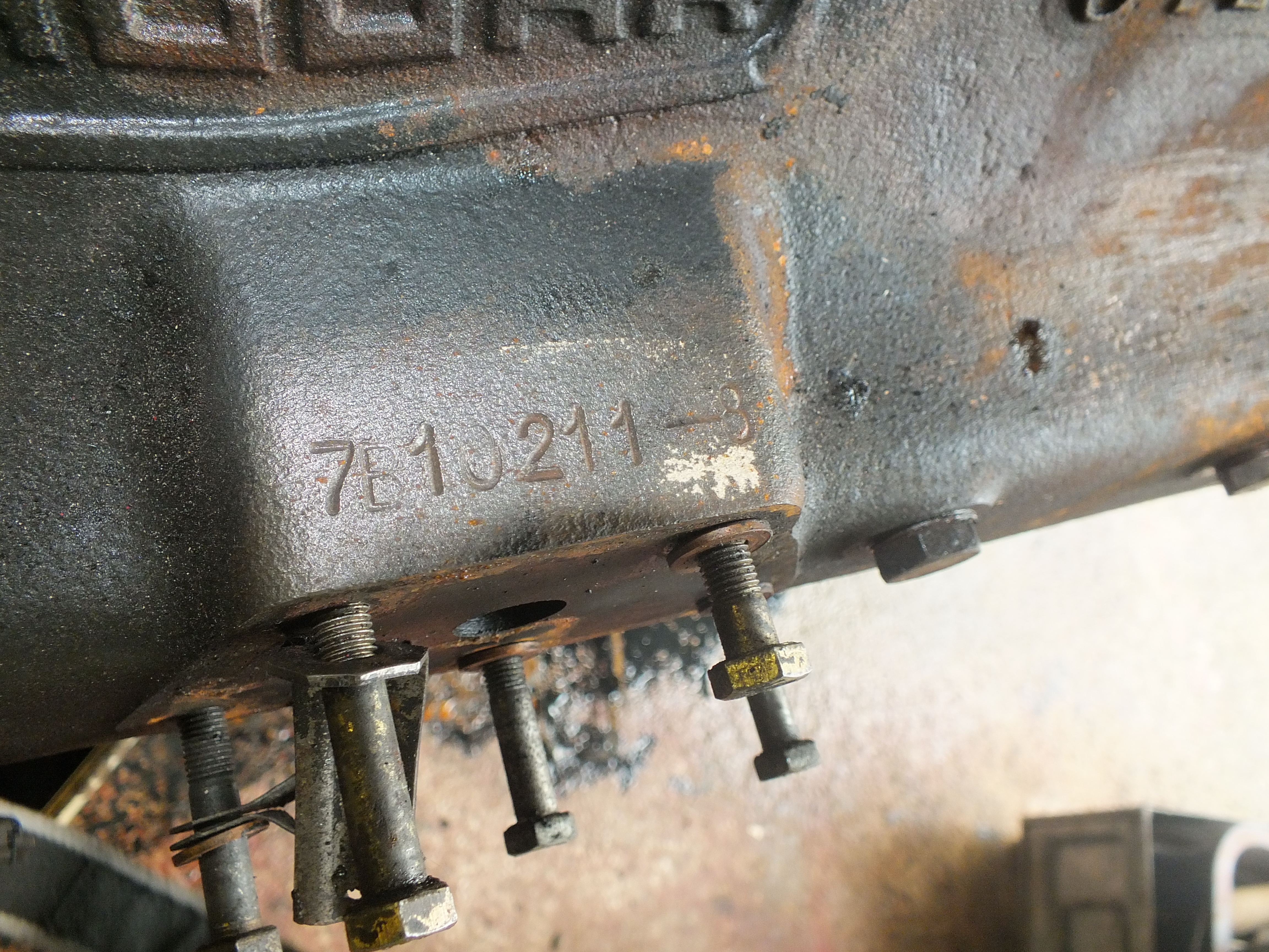 Engine number on top of oil filter housing