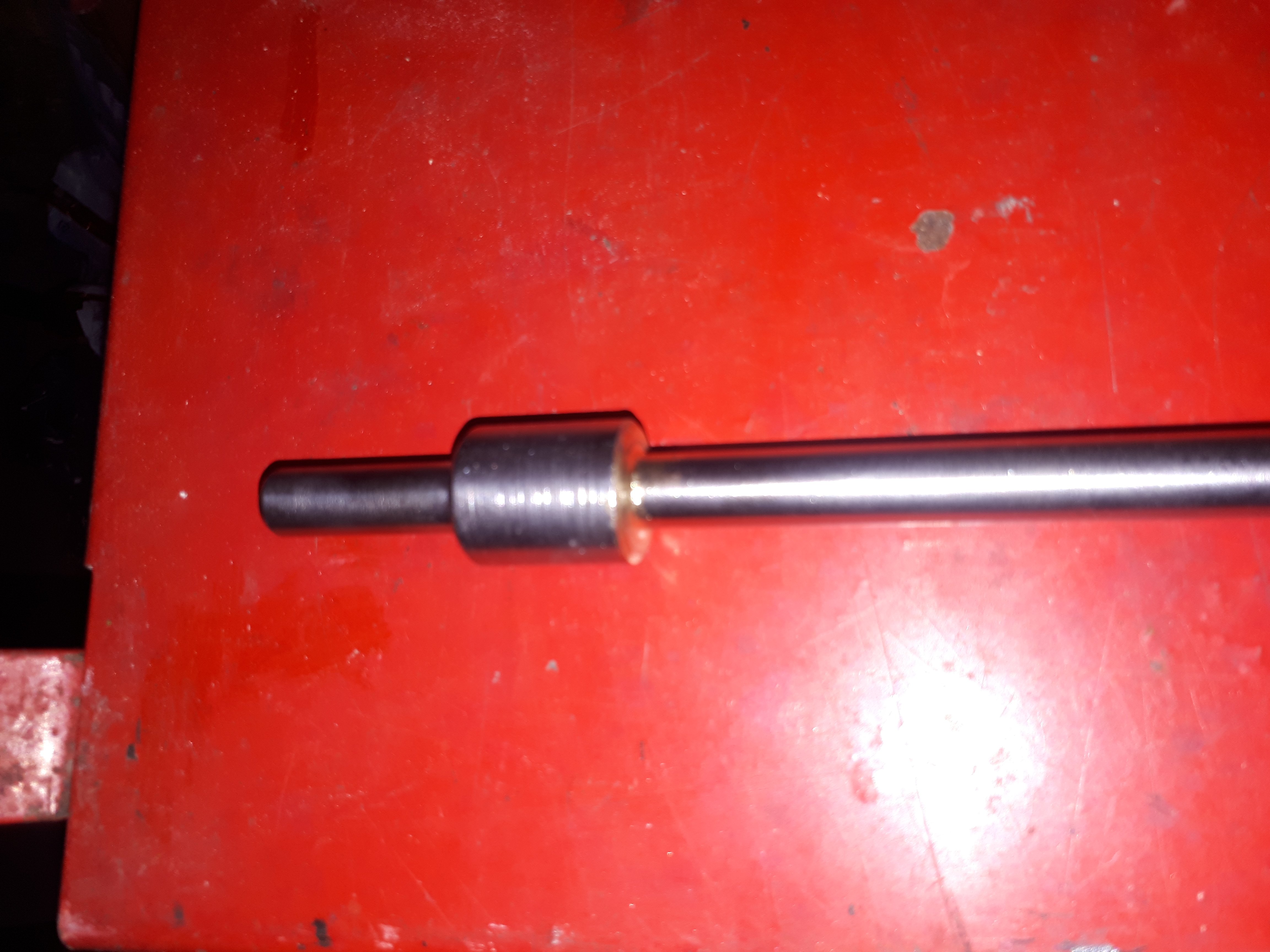 Throttle rod cleaned by wire brush.